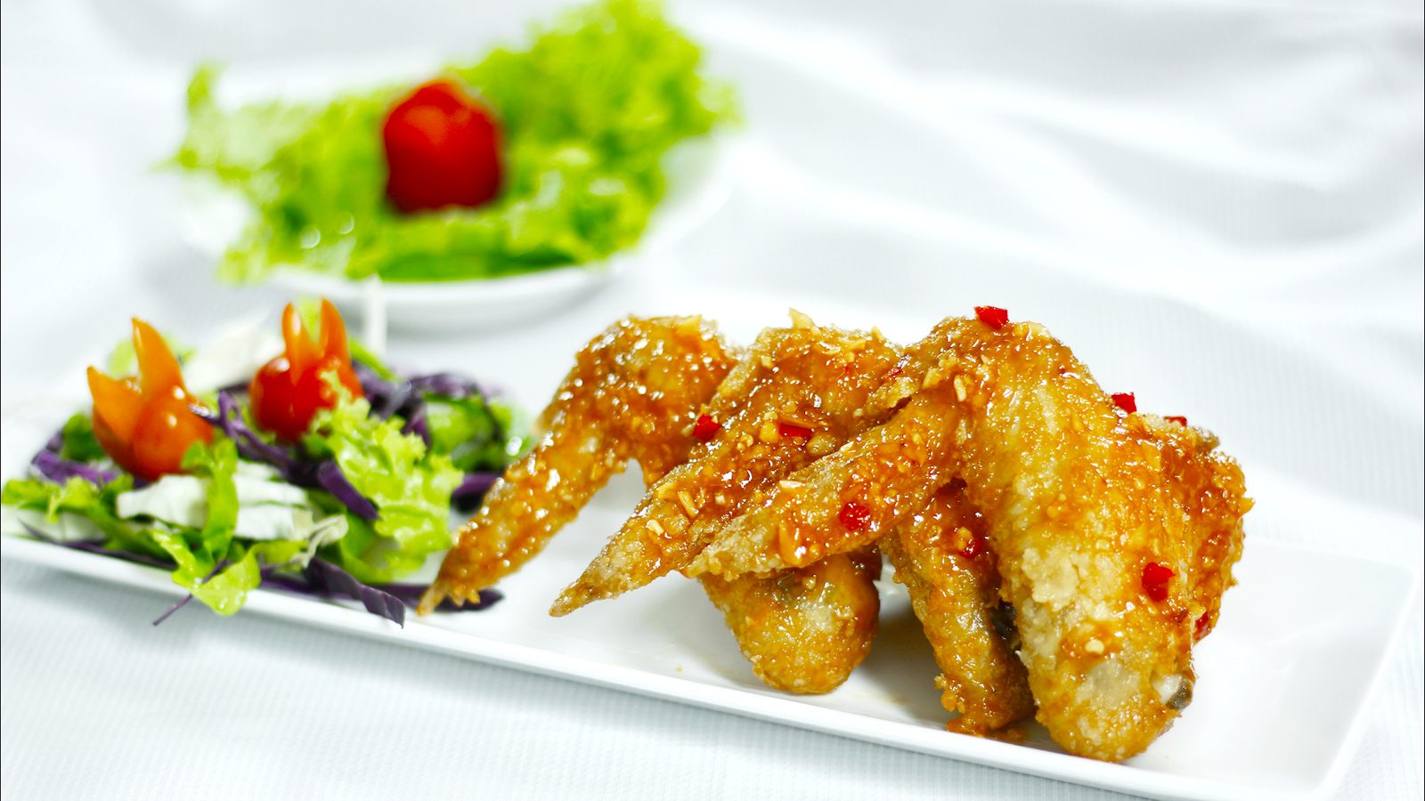 Cánh gà chiên nước mắm xào sốt Hoàn thiện cánh gà chiên nước mắm thấm sốt